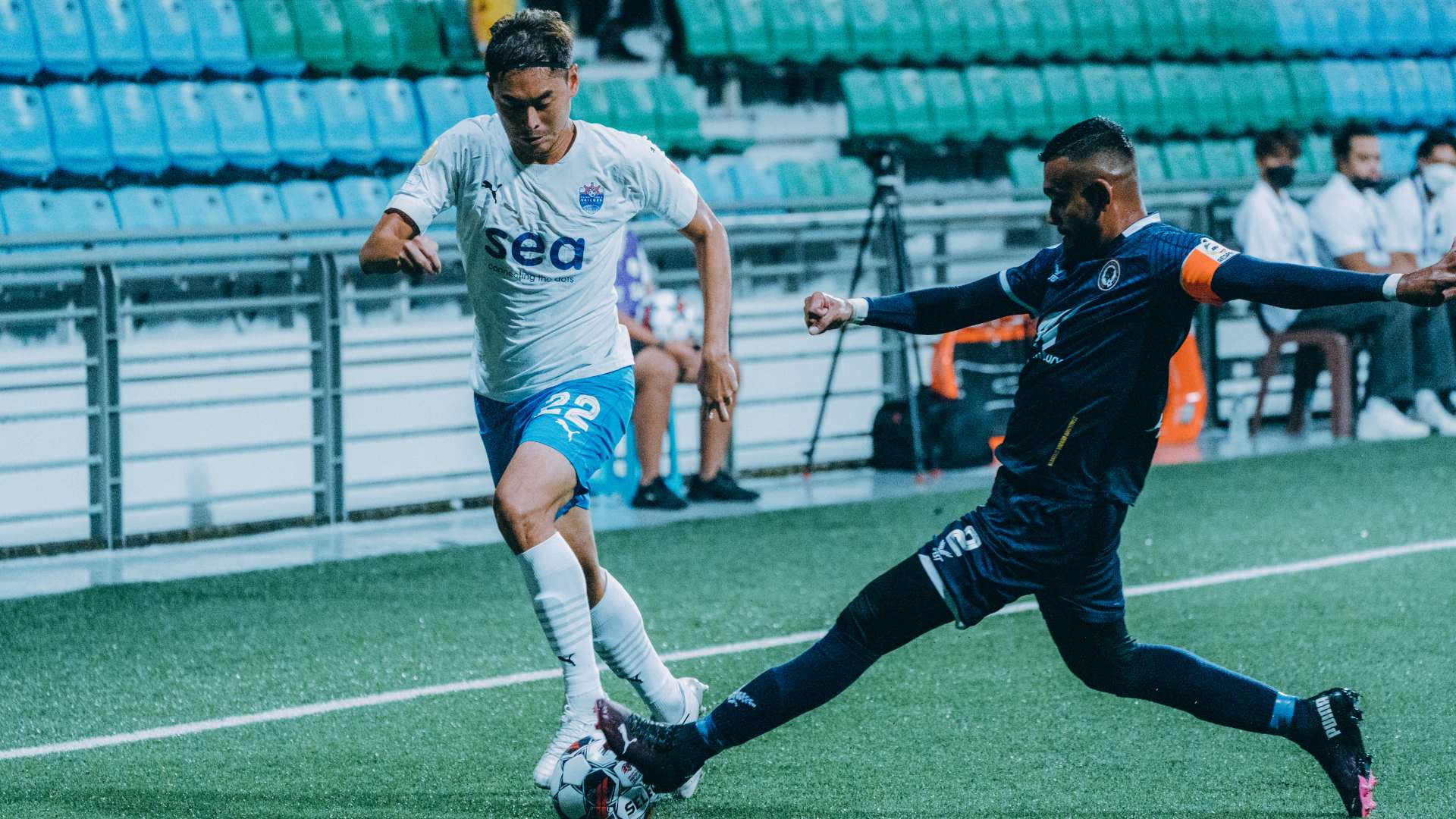 Gabriel Quak of Lion City Sailors fends off Faritz Abdul Hameed, captain of Tanjong Pagar United.