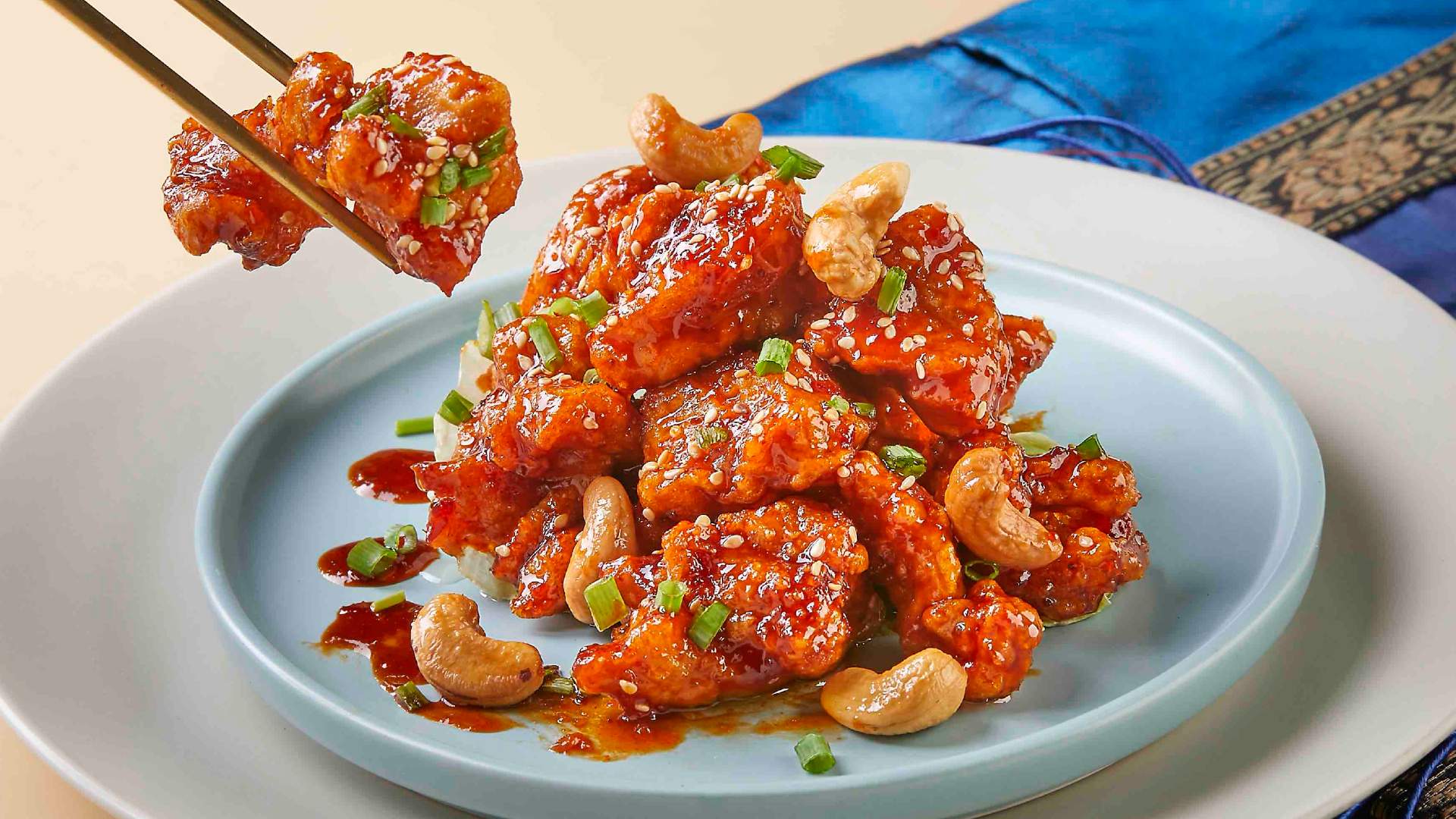 Grab a bite out of this sweet crispy Korean fried chicken called dakgangjeong, one of the many dishes available in Stamford Catering's new halal Korean buffet.