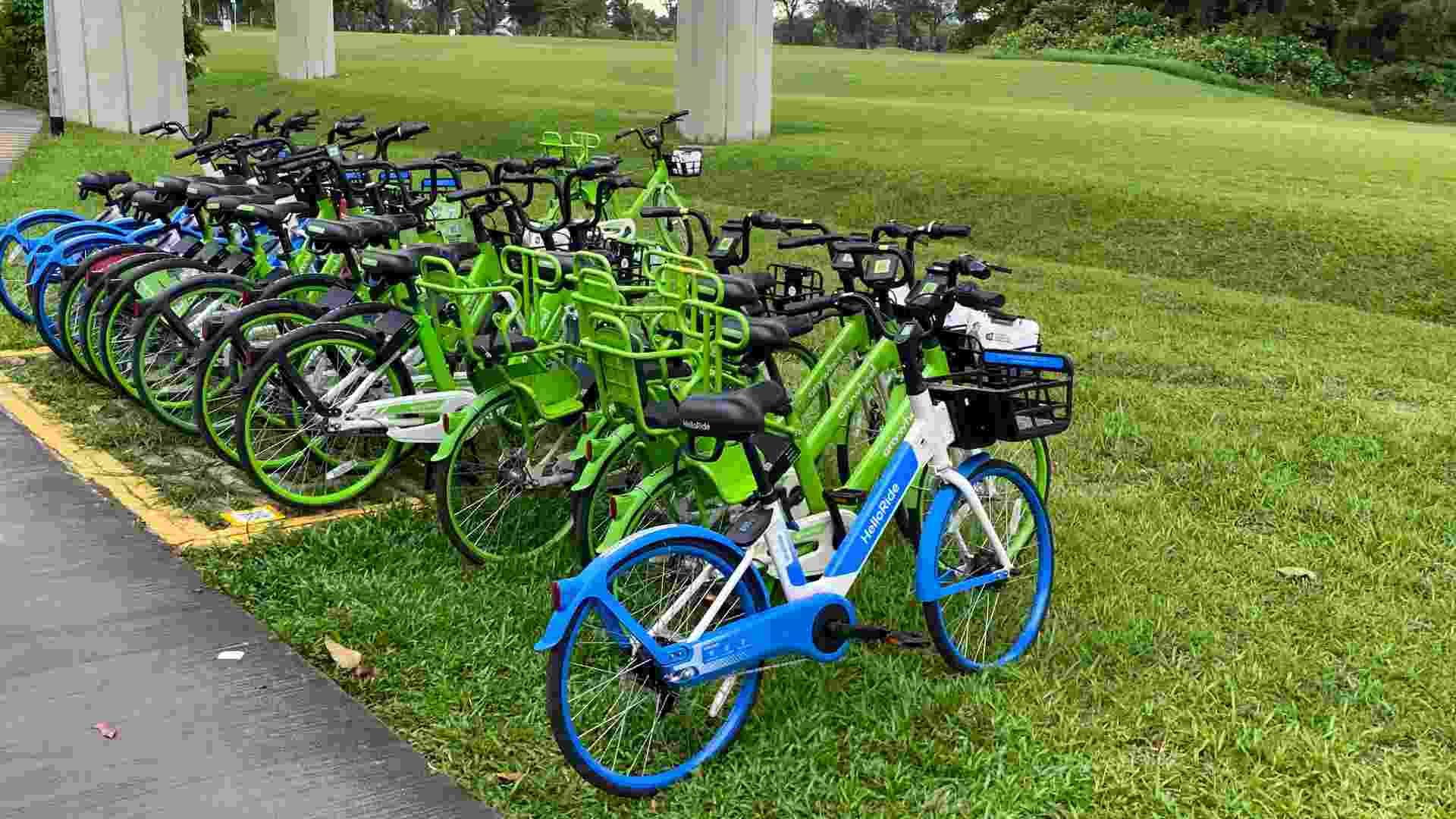 Anywheel and HelloRide shared bicycles parked near an MRT station