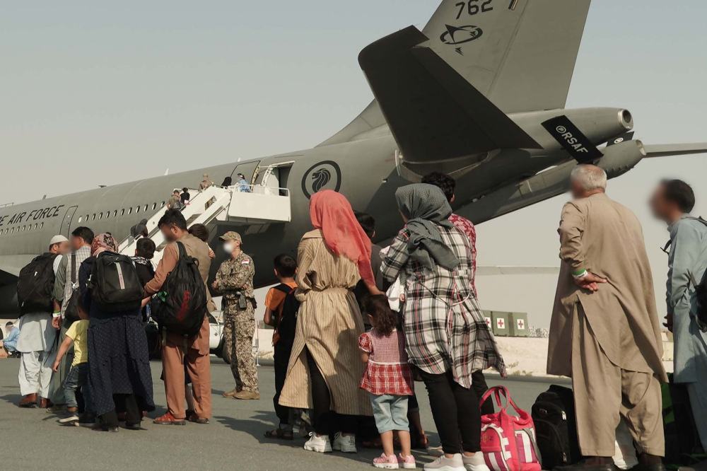 Afghanistan evacuees boarding the RSAF A330 MRTT from Qatar